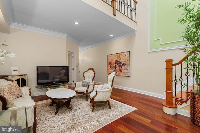 living room with dark wood-style floors, ornamental molding, stairs, and baseboards