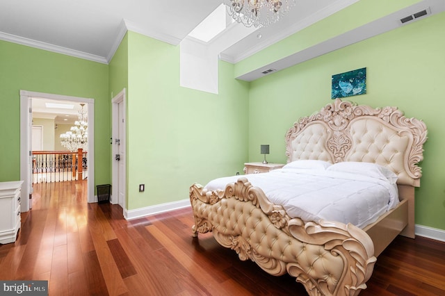 bedroom featuring crown molding, dark wood-type flooring, visible vents, and an inviting chandelier