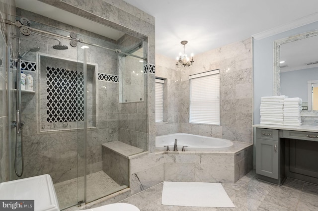 bathroom featuring a garden tub, crown molding, vanity, a shower stall, and a notable chandelier