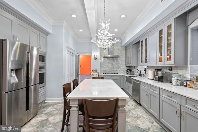 kitchen featuring appliances with stainless steel finishes, gray cabinetry, glass insert cabinets, and light stone counters