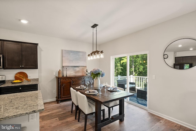 dining room with hardwood / wood-style flooring