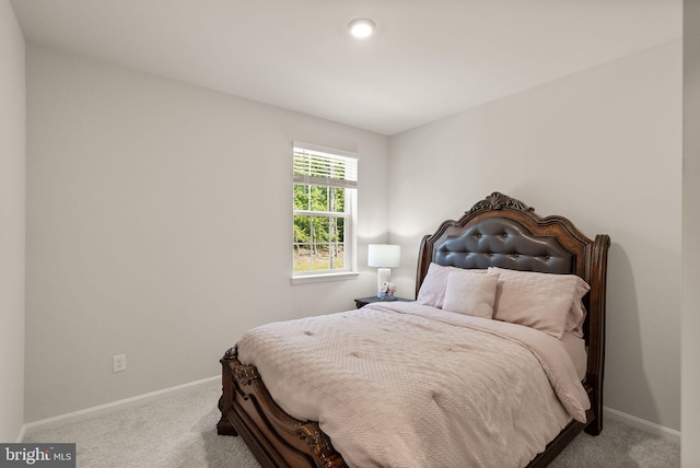 carpeted bedroom with baseboards