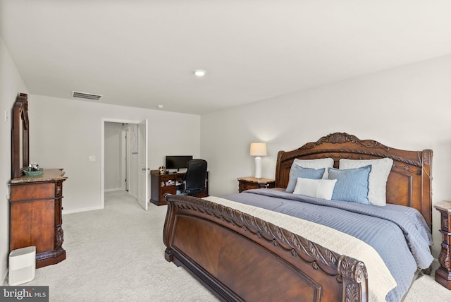 bedroom with baseboards, visible vents, and light colored carpet