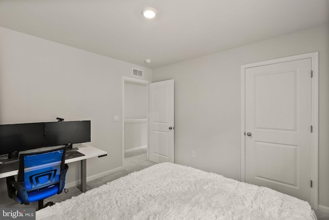 bedroom with carpet floors, baseboards, and visible vents