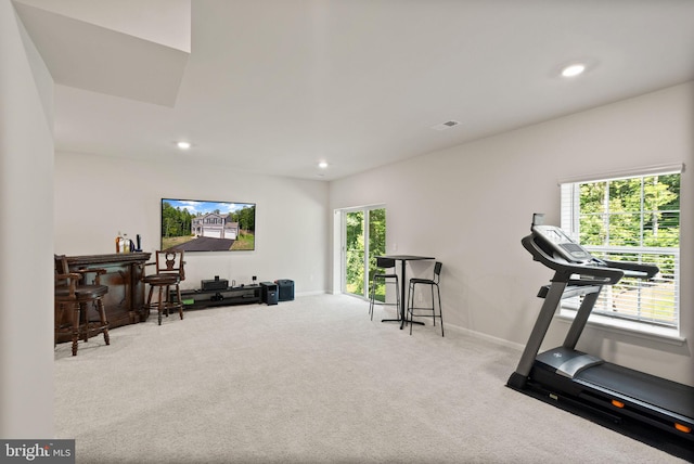 workout area featuring carpet floors, a wealth of natural light, and recessed lighting