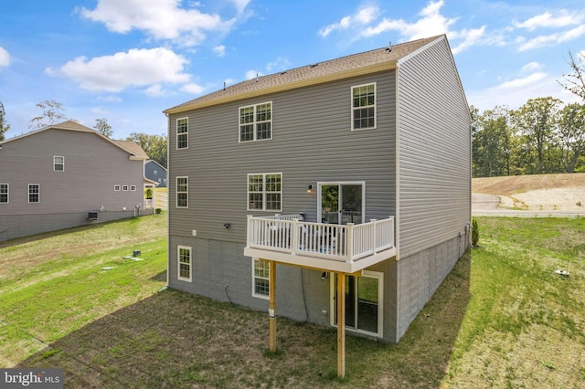 back of house with a yard and a wooden deck