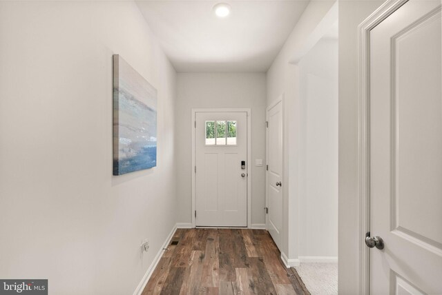 doorway to outside with dark hardwood / wood-style flooring