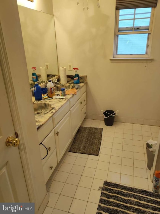 bathroom featuring tile patterned floors and vanity