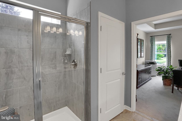 bathroom featuring tile patterned floors, vanity, and walk in shower