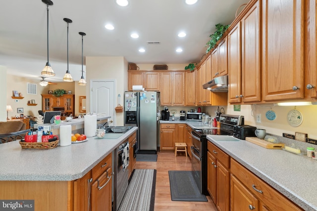 kitchen with light hardwood / wood-style flooring, stainless steel refrigerator with ice dispenser, range with two ovens, a center island, and ceiling fan