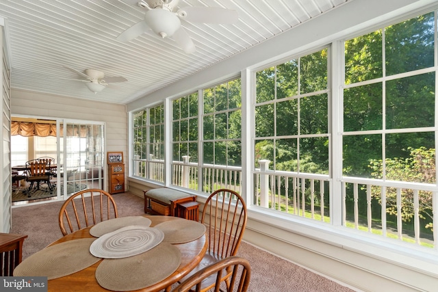 sunroom with a wealth of natural light and ceiling fan