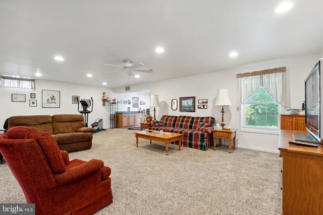 living room with ceiling fan and light carpet