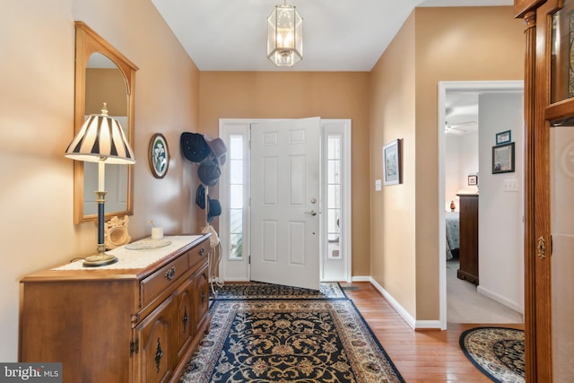 foyer featuring ceiling fan and hardwood / wood-style floors