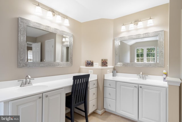 bathroom with tile patterned flooring and vanity