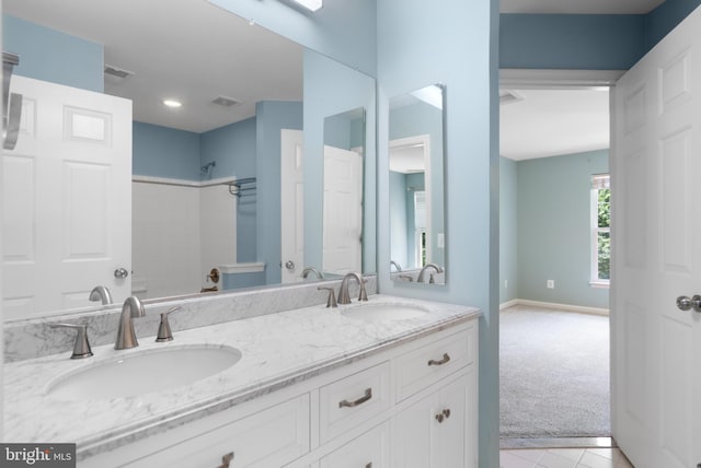 bathroom featuring double sink vanity and tile patterned floors