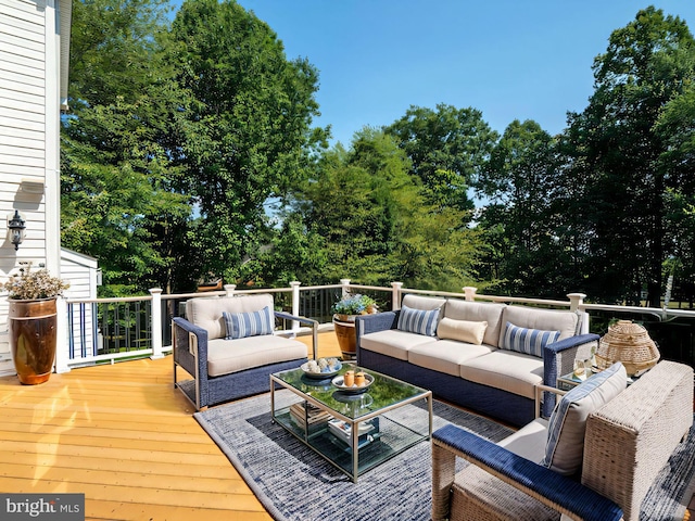 wooden terrace with outdoor lounge area