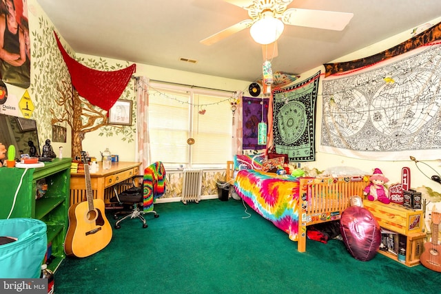 bedroom featuring radiator, ceiling fan, and carpet flooring