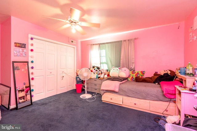 carpeted bedroom with ceiling fan and a closet