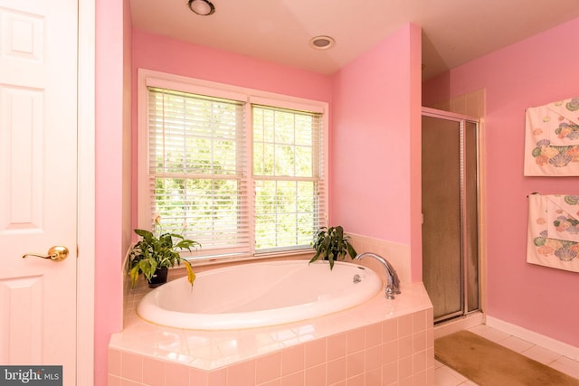 bathroom featuring shower with separate bathtub and tile patterned floors