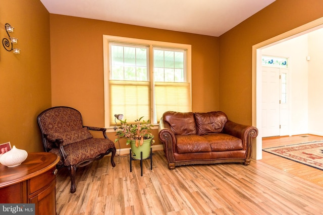 sitting room featuring light wood-style floors and baseboards