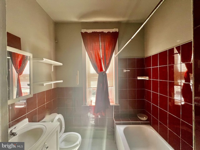 full bathroom with tile patterned flooring, shower / bathing tub combination, toilet, vanity, and tile walls