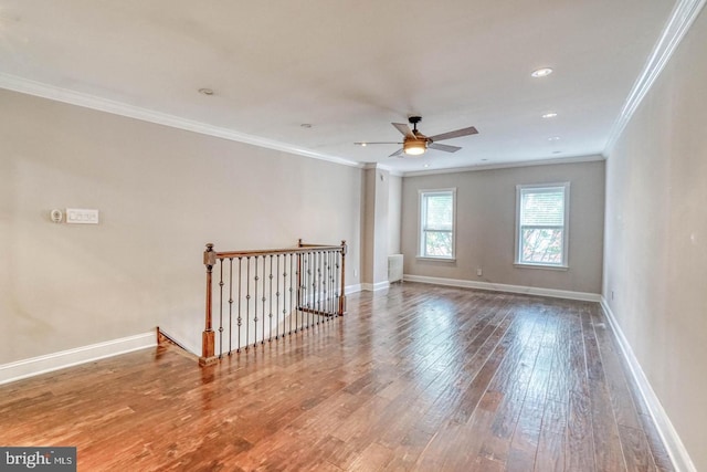 unfurnished room featuring ceiling fan, crown molding, and hardwood / wood-style flooring