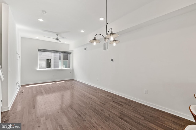 unfurnished living room with recessed lighting, wood finished floors, visible vents, and baseboards