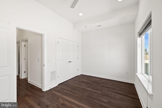 empty room with dark wood-type flooring