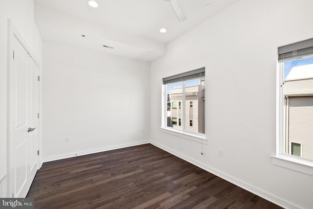 spare room featuring wood-type flooring