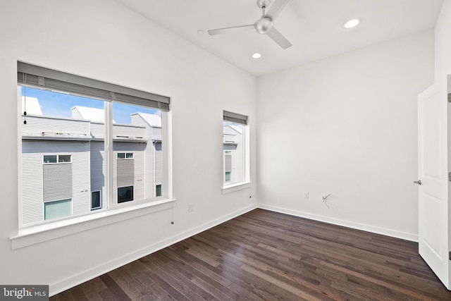 empty room featuring ceiling fan and hardwood / wood-style floors