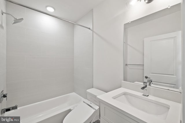 full bathroom with vanity, tiled shower / bath combo, and toilet