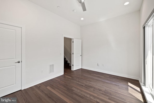 unfurnished bedroom with ceiling fan and hardwood / wood-style flooring