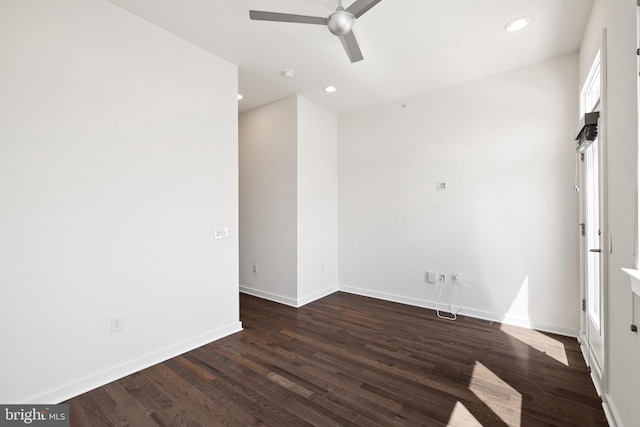 empty room with hardwood / wood-style floors and ceiling fan