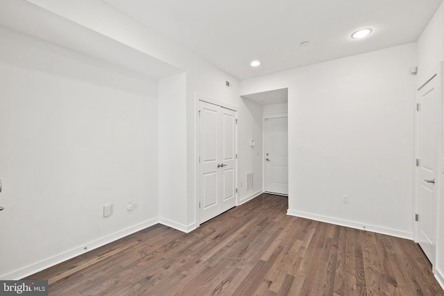 unfurnished bedroom with hardwood / wood-style floors