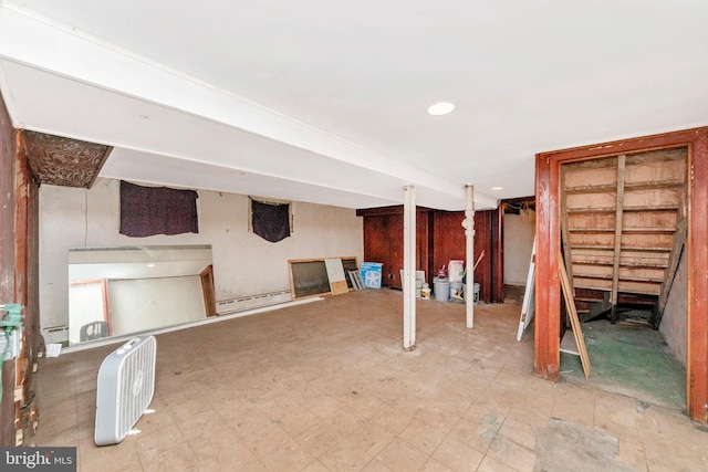 basement featuring a baseboard heating unit