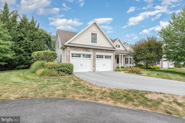 view of side of home featuring a garage and a lawn