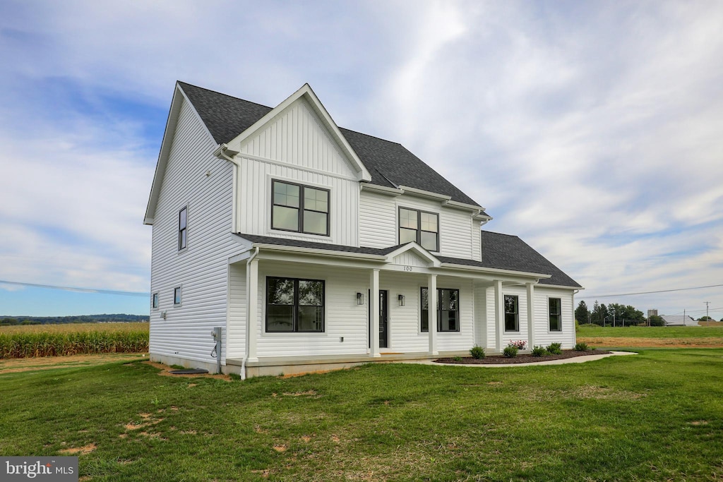 view of front of house featuring a front yard and a porch