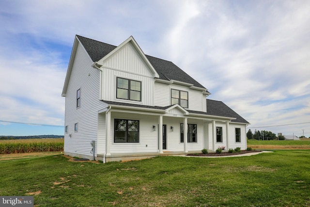 view of front of house featuring a front yard and a porch