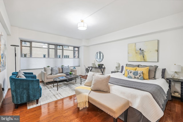 bedroom with hardwood / wood-style floors