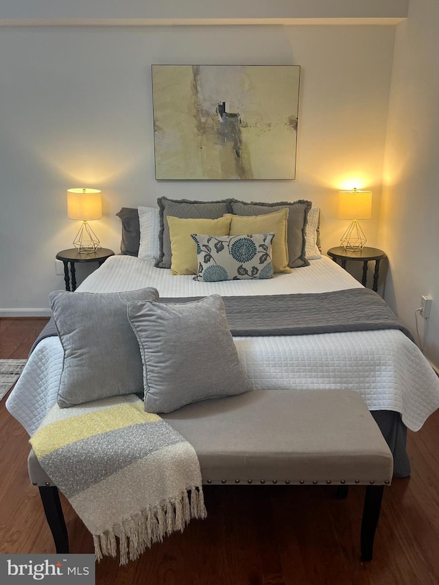 bedroom with wood finished floors