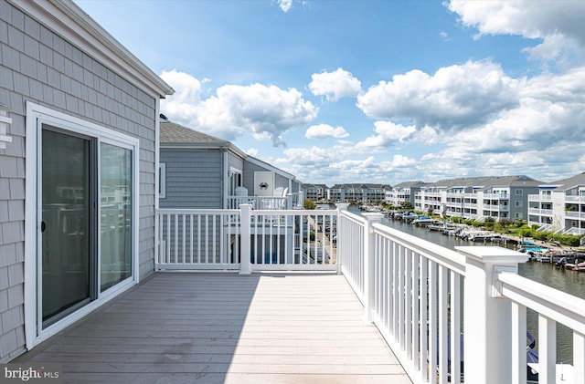 wooden deck featuring a water view