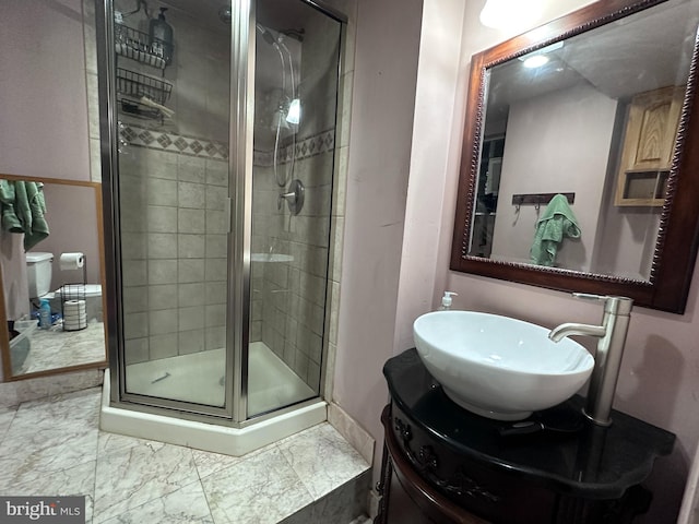 bathroom with tile patterned flooring, vanity, and a shower with shower door