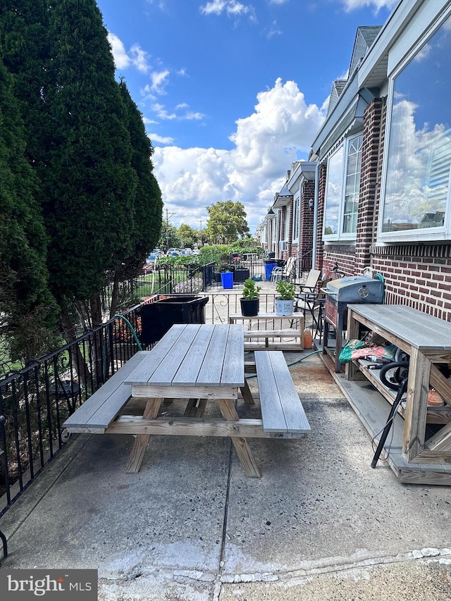 view of patio featuring a grill