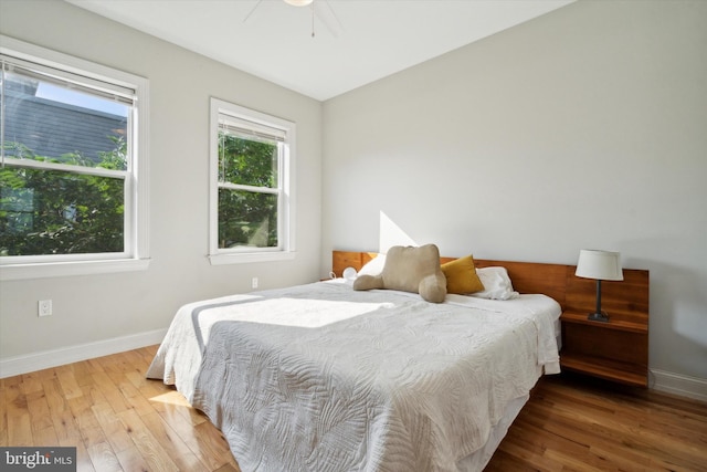 bedroom featuring wood-type flooring and ceiling fan