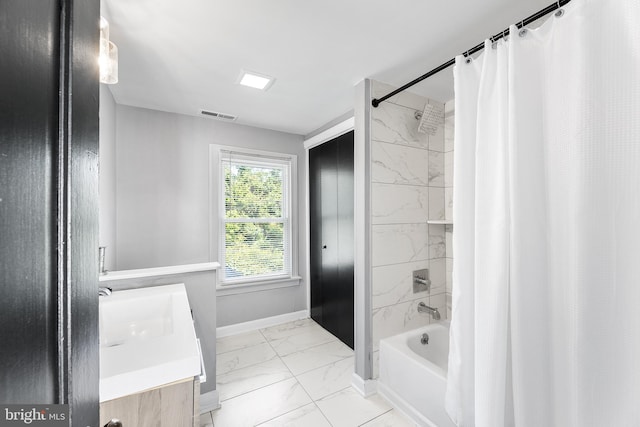 bathroom featuring vanity, shower / bath combo with shower curtain, and tile patterned floors