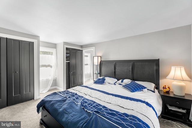 bedroom featuring light colored carpet