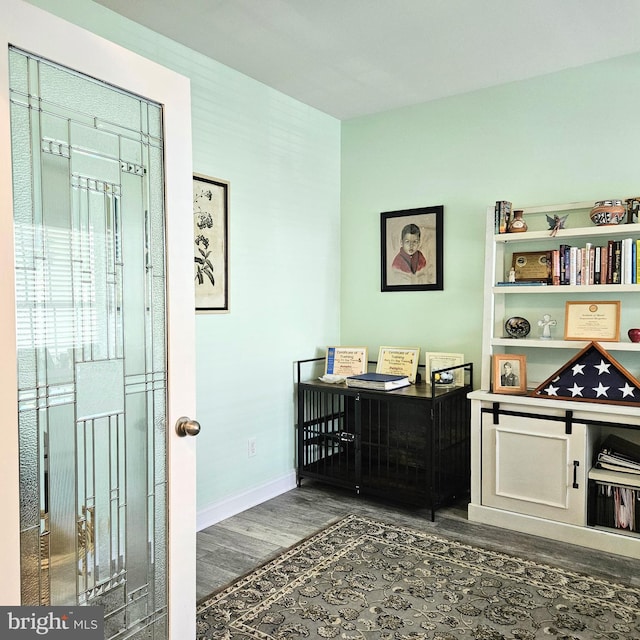 office with dark wood finished floors and baseboards