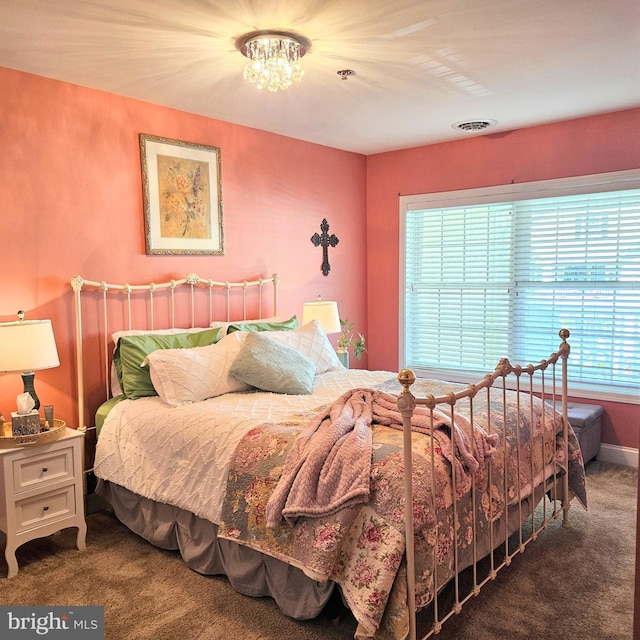 bedroom with visible vents and carpet flooring