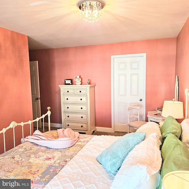 bedroom featuring an inviting chandelier