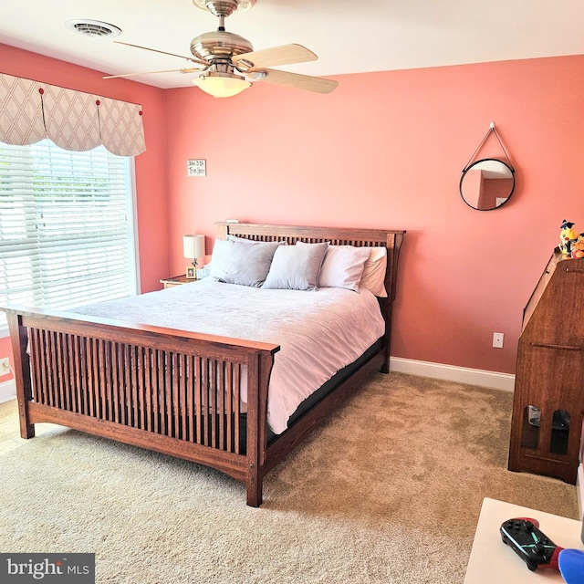 carpeted bedroom featuring ceiling fan